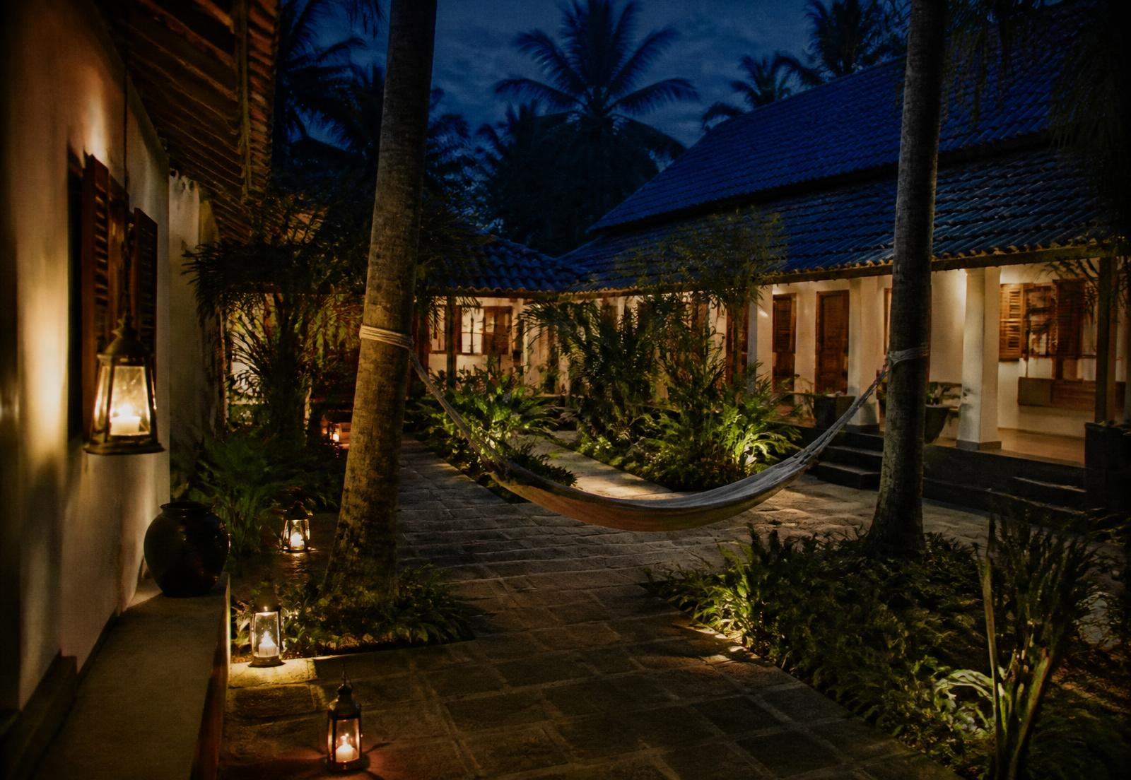 Lantern-lit courtyard at Zenways after sunset